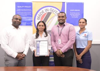 From left Invernisoft Inc. Managing Director Deon Thomas and Company Secretary Gigesha Thomas pose with GNBS Head of Certification Services (Ag.) Keon Rankin and GNB