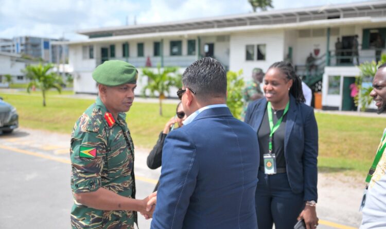Chief of Defence Staff Brigadier Omar Khan and WIN Presidential Candidate Azruddin Mohamed in hand shake, August 22, 2025