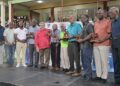 From left to right: Veteran West Indies cricketers Sir Clive Lloyd, Alvin Kallicharran, HE Deryck Murray, Sir Andy Roberts, Sir Gordon Greenidge and Collis King stand alongside the SVG prime minister, Ralph Gonsalves (in red). Photograph: Handout