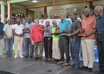 From left to right: Veteran West Indies cricketers Sir Clive Lloyd, Alvin Kallicharran, HE Deryck Murray, Sir Andy Roberts, Sir Gordon Greenidge and Collis King stand alongside the SVG prime minister, Ralph Gonsalves (in red). Photograph: Handout