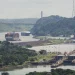 A cargo ship navigates through the Panama Canal, seen from the Cerro Ancon in Panama City, Tuesday, July 29, 2025. (AP Photo/Matias Delacroix)