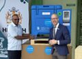Hon. Dr. Frank Anthony, Minister of Health receives one of the solar refrigerators from Mr. Gabriel Vockel, UNICEF Representative of Guyana and Suriname