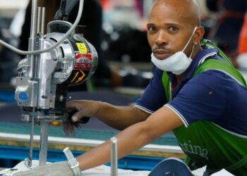 © ILO/Marcel Crozet A cutting operator works in a garment factory in Lesotho, a landlocked nation that plays a key role in supplying regional and continental markets with textiles, apparel and other goods.