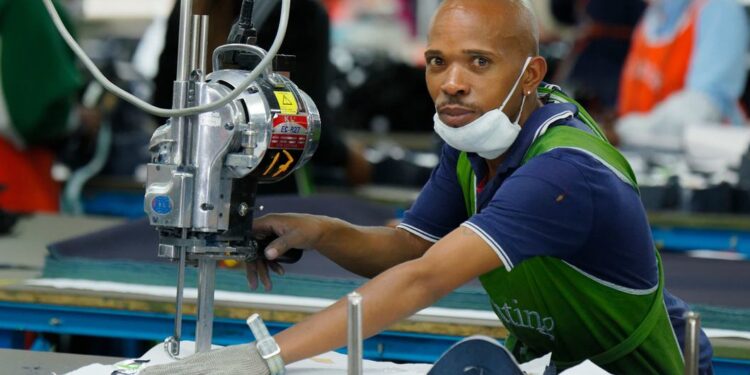 © ILO/Marcel Crozet A cutting operator works in a garment factory in Lesotho, a landlocked nation that plays a key role in supplying regional and continental markets with textiles, apparel and other goods.