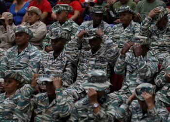 Members of the Bolivarian Militias listen to a recorded speech by President Nicolas Maduro at a military garrison in Caracas, Venezuela, on September 5. - AP Photo