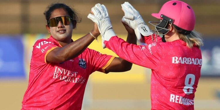 Chamari Athapaththu, left, and Georgia Redmayne of Barbados Royals celebrate the wicket of Jannillea Glasgow of Trinbago Knight Riders during the Women's 2025 Massy Caribbean Premier League match at Providence Stadium in Guyana, on September 10. (Photo by Ashley Allen - CPL T20/CPL T20 via Getty Images) -