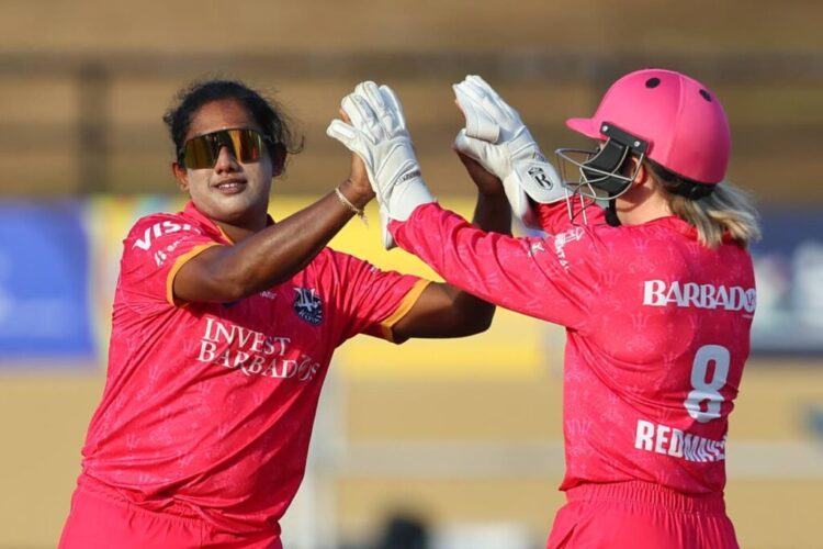 Chamari Athapaththu, left, and Georgia Redmayne of Barbados Royals celebrate the wicket of Jannillea Glasgow of Trinbago Knight Riders during the Women's 2025 Massy Caribbean Premier League match at Providence Stadium in Guyana, on September 10. (Photo by Ashley Allen - CPL T20/CPL T20 via Getty Images) -