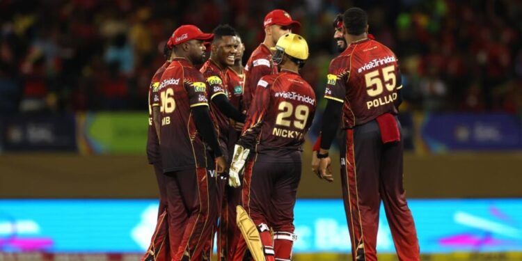 Akeal Hosein (C) of Trinbago Knight Riders celebrates with teammates after getting the wicket of Keemo Paul of Guyana Amazon Warriors during the 2025 Republic Bank Caribbean Premier League match at Providence Stadium on September 6, in Georgetown, Guyana. - (CPL T20)