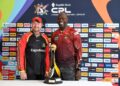 TKR assistant coach Ottis Gibson, right, and Guyana Amazon Warriors coach Lance Klusener stand next to the trophy their teams will be fighting for in the Republic Bank Caribbean Premier League final on September 21. PHOTO COURTESY CPL -
