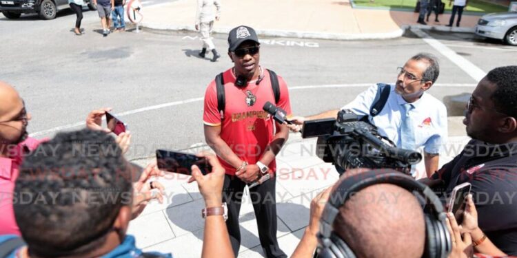Trinbago Knight Riders’ coach Dwayne Bravo speaks with the media on his team’s return to TT, at the Piarco International Airport, on September 22, following their win against Guyana Amazon Warriors, at the Guyana National Stadium, Providence, on September 21. - Photo by Lincoln Holder