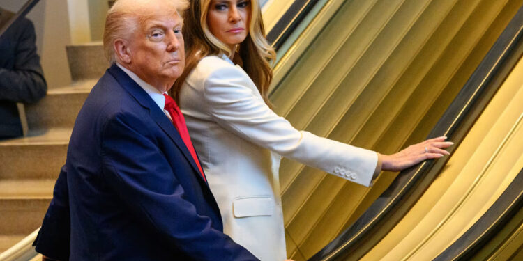 The president and first lady wait on a stalled escalator at the United Nations on Tuesday.Alexi J. Rosenfeld / Getty Images