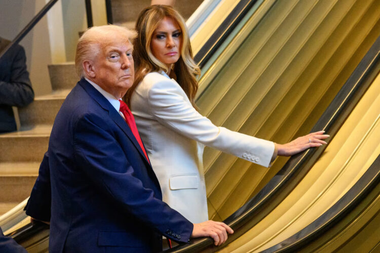 The president and first lady wait on a stalled escalator at the United Nations on Tuesday.Alexi J. Rosenfeld / Getty Images