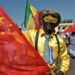 Friendly welcome … people in Dakar prepare to welcome the Chinese president in 2009. Photograph: Seyllou/AFP/Getty Images
