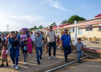 Incoming Opposition Leader Azruddin Mohamed ( in khaki polo) visiting with the Indigenous community (Team Mohamed's Facebook photo)
