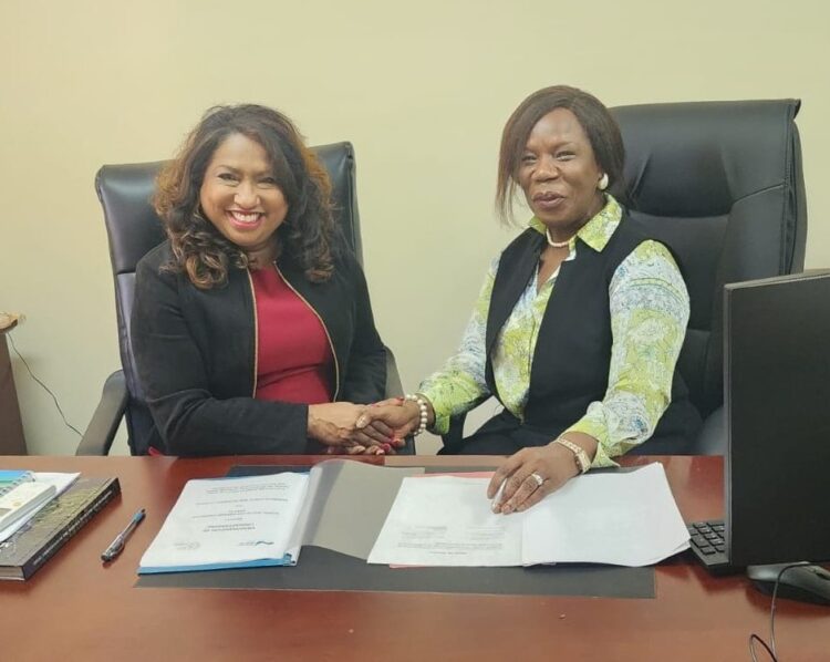 (L-R) Dr. Lisa Indar, Executive Director, CARPHA and Professor Paulette Bynoe, Chair, GWP-C, following the signing of the MOU by both entities.
