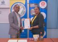Centaur Holdings CEO, Oscar Richmond and General Manager, Michellina Richmond pose proudly with GNBS Made in Guyana Certificate.