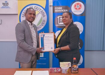 Centaur Holdings CEO, Oscar Richmond and General Manager, Michellina Richmond pose proudly with GNBS Made in Guyana Certificate.