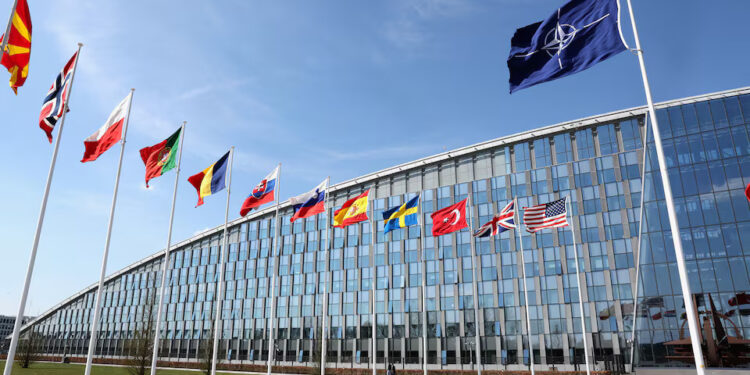 National flags of Alliance's members flutter at NATO headquarters in Brussels, Belgium April 2, 2025. REUTERS/Yves Herman/ File Photo