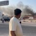 This frame grab taken from an AFPTV footage shows a man looking at smoke billowing after explosions in Doha's capital Qatar on September 9, 2025. An Israeli military official told AFP that the military had carried out air strikes on Doha on September 9 in an operation targeting senior leaders of Palestinian militant group Hamas. (Photo by Jacqueline PENNEY / AFPTV / AFP) (Photo by JACQUELINE PENNEY/AFPTV/AFP via Getty Images)