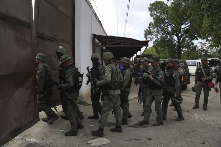 Soldiers raid the Tocoron Penitentiary Center where the Tren de Aragua gang originated, in Tocoron, Venezuela, Sept 20,2023, AP Photo/ Ariana Cubillos, File