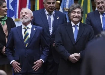 Brazil’s President Luiz Inacio Lula da Silva, front left, and Argentina’s President Javier Milei, stand next to each other as they get into position for a group photo with other leaders attending the Mercosur Summit in Buenos Aires, Argentina, July 3, 2025. (AP Photo/Natacha Pisarenko, File)