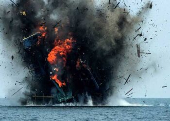 Fishing boat being blown up in indonesia