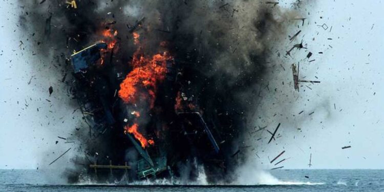 Fishing boat being blown up in indonesia