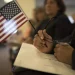 A candidate for US citizenship holds a US flag during a naturalization ceremony for new US citizens February 16, 2017 in Newark, New Jersey. Eighty-nine applicants from thirty-seven countries received their certificates of citizenship. Robert Nickelsberg/Getty Images