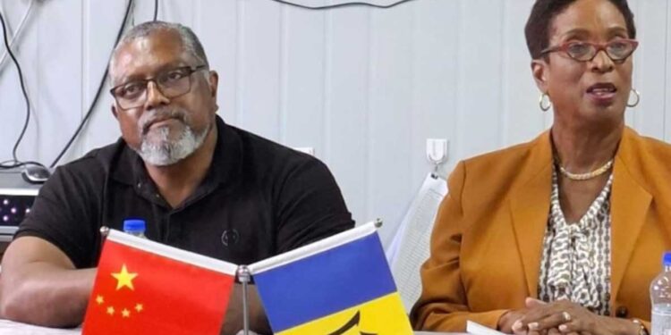 Minister of Training and Tertiary Education, Sandra Husbands, (right) speaking to the media during a recent tour of the Dukes Agricultural Station in St Thomas and the Hope Agricultural Institute in St. Lucy. Looking on is Minister of Agriculture, Food and Nutritional Security, Indar Weir. (N. Phillips/BGIS)