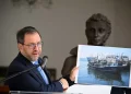 Venezuela's Foreign Minister Yvan Gil shows a picture of a fishing boat during a press conference at the Ministry of Foreign Affairs in Caracas on September 13, 2025. Federico Parra/Getty Images