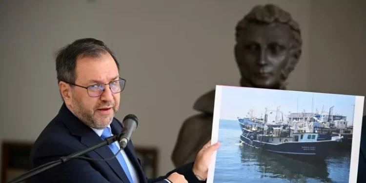 Venezuela's Foreign Minister Yvan Gil shows a picture of a fishing boat during a press conference at the Ministry of Foreign Affairs in Caracas on September 13, 2025. Federico Parra/Getty Images
