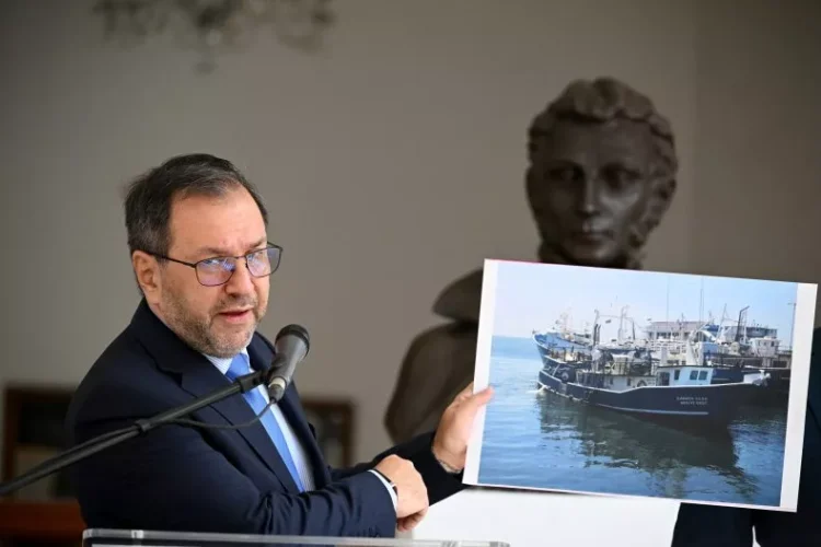 Venezuela's Foreign Minister Yvan Gil shows a picture of a fishing boat during a press conference at the Ministry of Foreign Affairs in Caracas on September 13, 2025. Federico Parra/Getty Images