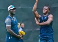 (FILE) West Indies’ pacer Shamar Joseph bowls as head coach Daren Sammy looks on during a practice session on the eve of their second one-day international against Sri Lanka at the Pallekele International Cricket Stadium in Kandy on October 22, 2024. - FILE PHOTO