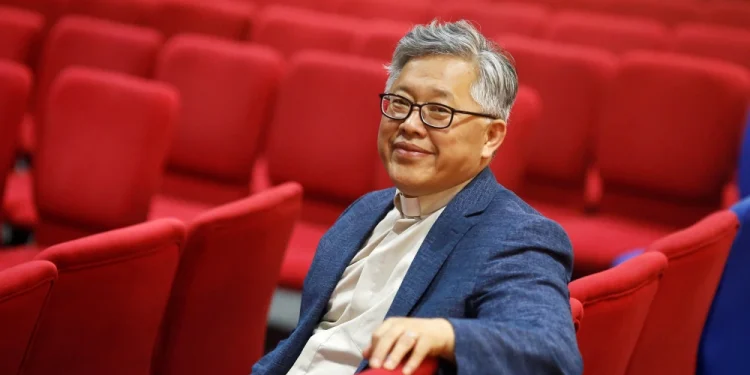 Jin Mingri, the head pastor of Zion Church, in the congregation hall in Beijing in 2018.Thomas Peter / Reuters file