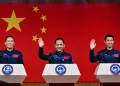 Astronauts Zhang Lu, Wu Fei and Zhang Hongzhang are named on the Shenzhou 21 mission. (Image credit: HECTOR RETAMAL / Getty Images)
