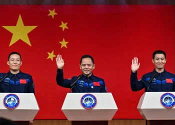 Astronauts Zhang Lu, Wu Fei and Zhang Hongzhang are named on the Shenzhou 21 mission. (Image credit: HECTOR RETAMAL / Getty Images)