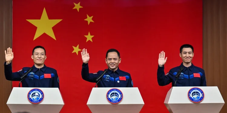 Astronauts Zhang Lu, Wu Fei and Zhang Hongzhang are named on the Shenzhou 21 mission. (Image credit: HECTOR RETAMAL / Getty Images)