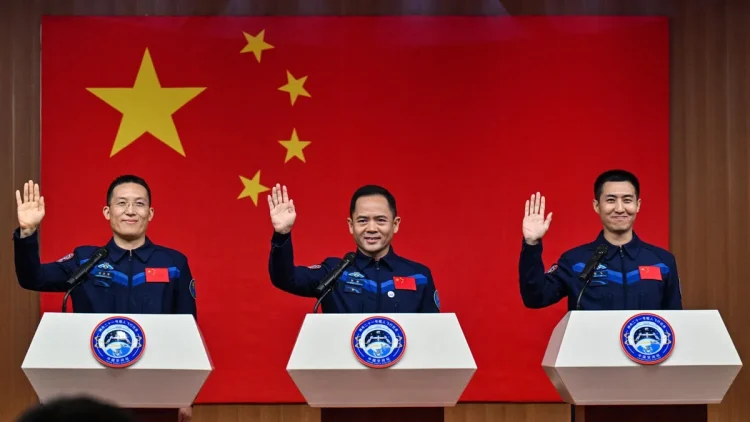 Astronauts Zhang Lu, Wu Fei and Zhang Hongzhang are named on the Shenzhou 21 mission. (Image credit: HECTOR RETAMAL / Getty Images)