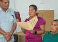 Region Eight Regional Chairperson Tarcellia John (taking the oath) and Vice Chairperson Samantha John (sitting)