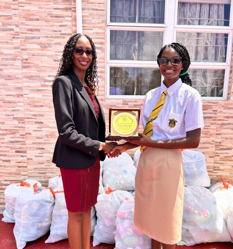 Sian Jeune receiving her plaque