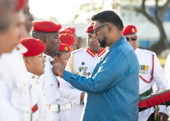 Commander-in-Chief of the Armed Forces, President Dr Mohamed Irfaan Ali, decorates one of the 32 Other Ranks with a medal