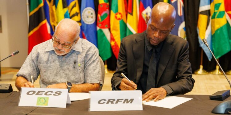 Dr. Didacus Jules, Director General of the OECS (left), with Dr. Marc Williams, Executive Director of the CRFM Secretariat, at the signing of a new Memorandum of Understanding during CWA 2025
CRFM Signs MoUs with OECS and UWI to Boost Fisheries and Blue Economy