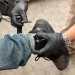 An ankle monitoring bracelet is being attached to allow tracking.