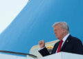 U.S. President Donald Trump gestures as he disembarks Air Force One at Ben Gurion International Airport, amid a U.S.-brokered prisoner-hostage swap and ceasefire deal between Israel and Hamas, in Lod, Israel, October 13, 2025. REUTERS/Evelyn Hockstein