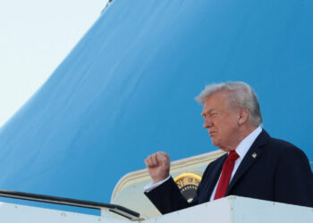U.S. President Donald Trump gestures as he disembarks Air Force One at Ben Gurion International Airport, amid a U.S.-brokered prisoner-hostage swap and ceasefire deal between Israel and Hamas, in Lod, Israel, October 13, 2025. REUTERS/Evelyn Hockstein