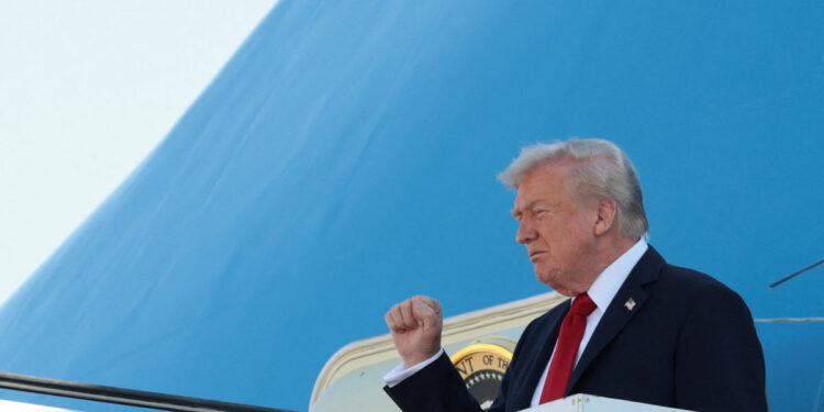 U.S. President Donald Trump gestures as he disembarks Air Force One at Ben Gurion International Airport, amid a U.S.-brokered prisoner-hostage swap and ceasefire deal between Israel and Hamas, in Lod, Israel, October 13, 2025. REUTERS/Evelyn Hockstein