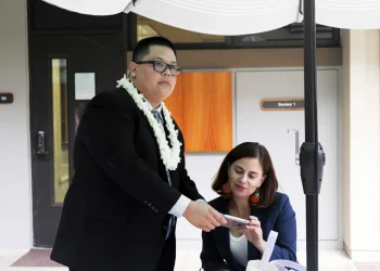 Attorney Julian Aguon meets with colleague Addie Rolnick after arguing before a panel of U.S Circuit Court of Appeals judge in Honolulu on Oct. 10.8.2018