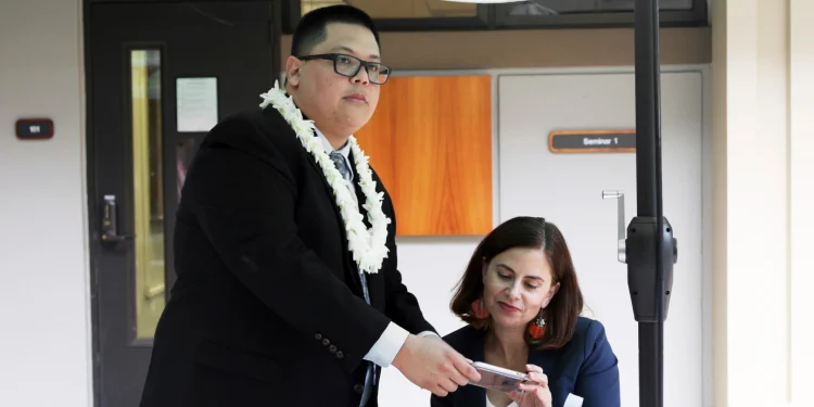 Attorney Julian Aguon meets with colleague Addie Rolnick after arguing before a panel of U.S Circuit Court of Appeals judge in Honolulu on Oct. 10.8.2018