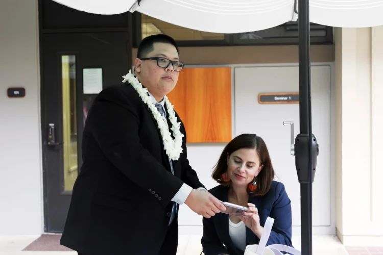 Attorney Julian Aguon meets with colleague Addie Rolnick after arguing before a panel of U.S Circuit Court of Appeals judge in Honolulu on Oct. 10.8.2018