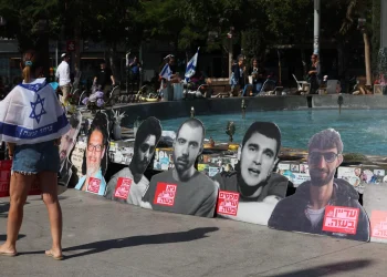 People walk past portraits of Israelis held hostage in the Gaza Strip since 2023, during a rally in Tel Aviv marking two years since the Hamas terrorist attack, Oct. 7, 2025.
AHMAD GHARABLI/AFP/Getty